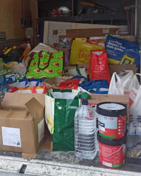 Recolha solidária de bens essenciais na Junta de Freguesia do Bonfim com voluntários e doações organizadas para envio à Região Centro.