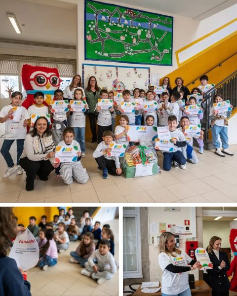 Alunos do 3.º ano da Escola Básica do Campo 24 de Agosto celebram a vitória nas Olimpíadas de Educação Financeira, acompanhados por professores e representantes institucionais.
